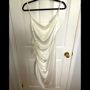 Never worn. Silk-like party dress, great for bachelorette. Side hem adjustable.